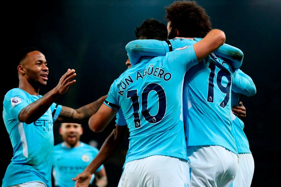 Manchester City's Sergio Aguero (centre) celebrates scoring his side's third goal