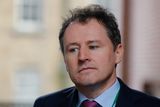 thumbnail: Minister for Agriculture Charlie McConalogue defended the Government's record in assisting local authorities with the repair and upkeep of the State's roads network.