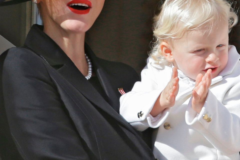 Princess Charlene, Prince Albert II of Monaco's wife, and their son Prince Jacques, attend from the Monaco palace to the Monaco's national day ceremony, in Monaco, Friday Nov. 19, 2016. Monaco's Fete Nationale has been celebrated since the reign of Prince Charles III in 1857. (AP Photo/Claude Paris)