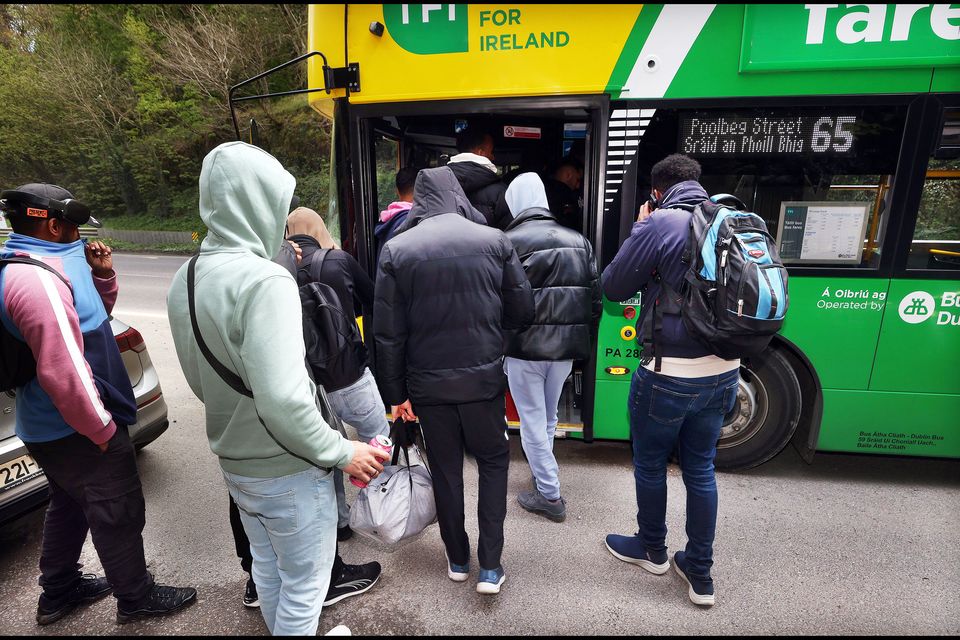 Asylum-seekers at Crooksling board the 65 bus to head back to Dublin city centre. Photo: Steve Humphreys