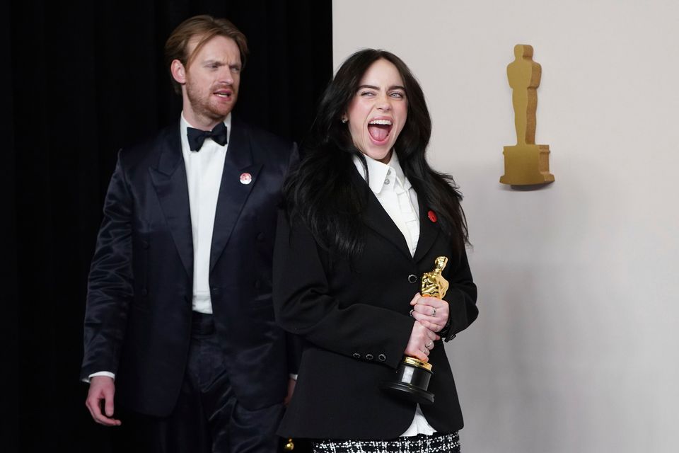 Finneas O'Connell, left, and Billie Eilish pose in the press room with the award for best original song for "What Was I Made For?" from "Barbie" at the Oscars on Sunday, March 10, 2024, at the Dolby Theatre in Los Angeles. (Photo by Jordan Strauss/Invision/AP)