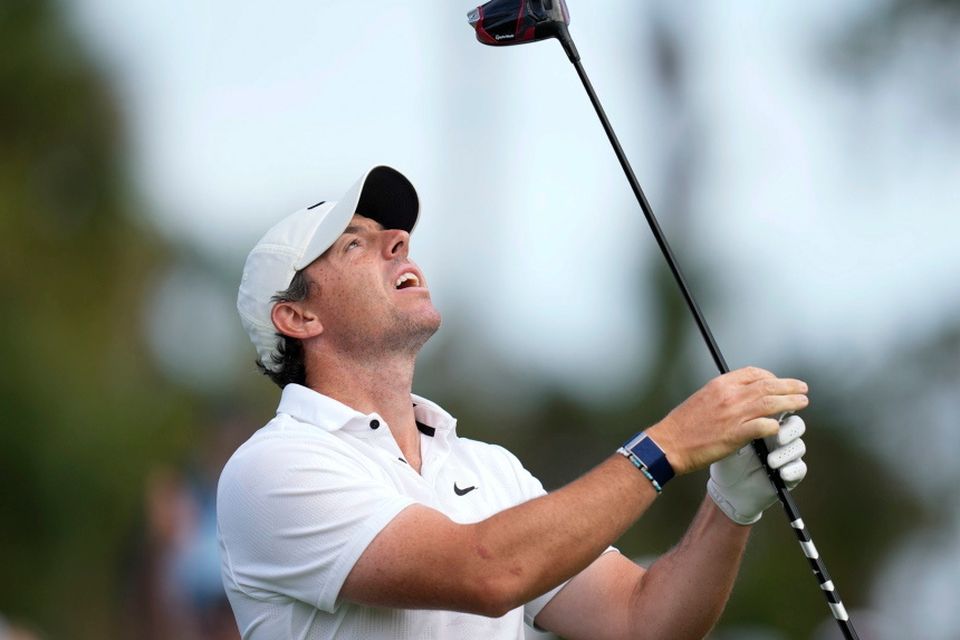 Rory McIlroy reacts after his tee shot on the 16th hole