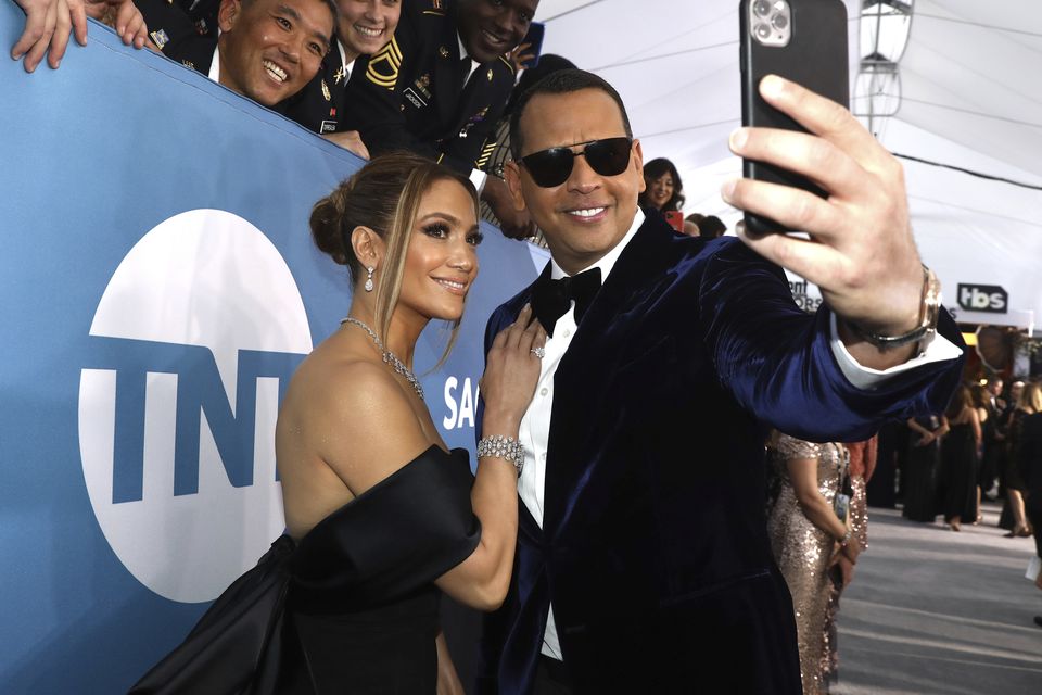 Jennifer Lopez smiles for the camera with Alex Rodriguez (Matt Sayles/Invision/AP)