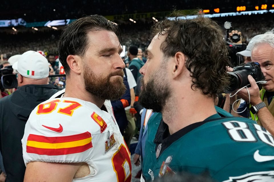 Kansas City Chiefs tight end Travis Kelce, left, greets Philadelphia Eagles tight end Dallas Goedert after the NFL Super Bowl 59 football game, Sunday, Feb. 9, 2025, in New Orleans. (AP Photo/Ashley Landis)