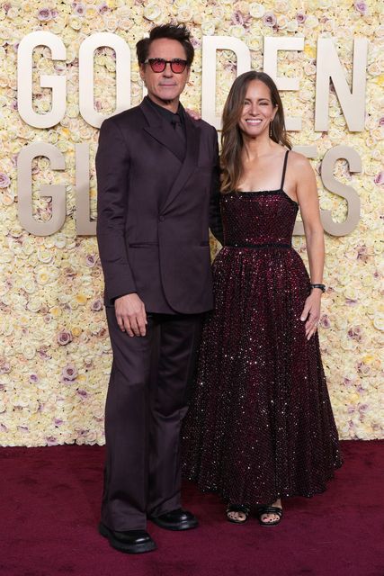 Robert Downey Jr., left, and Susan Downey arrive at the 81st Golden Globe Awards on Sunday, Jan. 7, 2024, at the Beverly Hilton in Beverly Hills, Calif. (Photo by Jordan Strauss/Invision/AP)