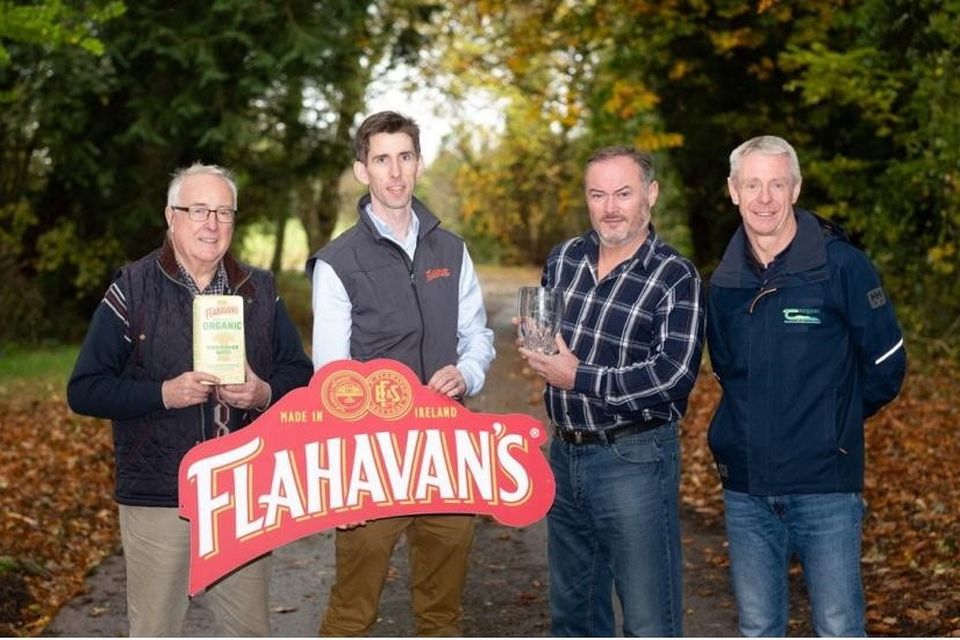 Eoghan O'Sullivan (second from the right) receives his Flahavan's Organic Oat Grower of the year 2024 award from Johnny Flahavan