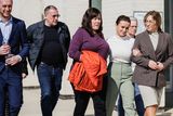 thumbnail: Sarah Corbett Lynch (in white) with Tracey Corbett Lynch (right) at court.