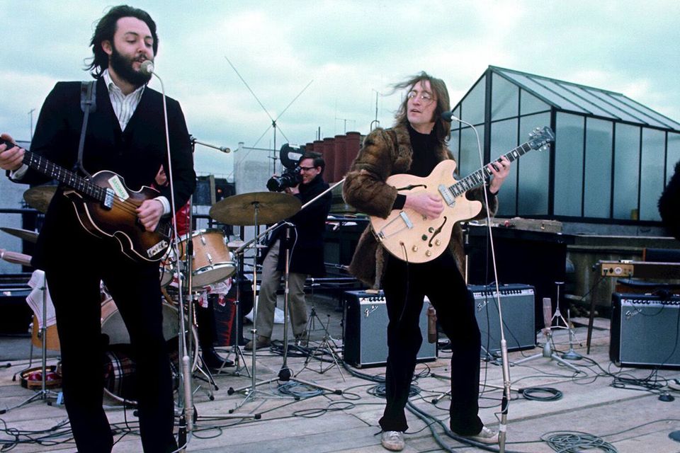 Paul, John and George perform on the rooftop of London's Saville Row