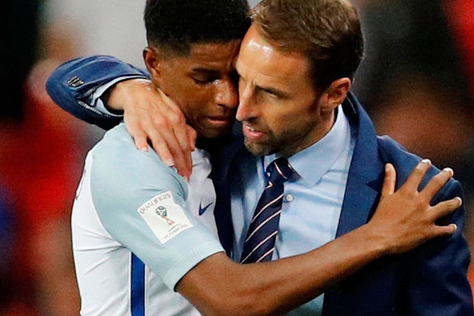 England’s Marcus Rashford hugs England manager Gareth Southgate