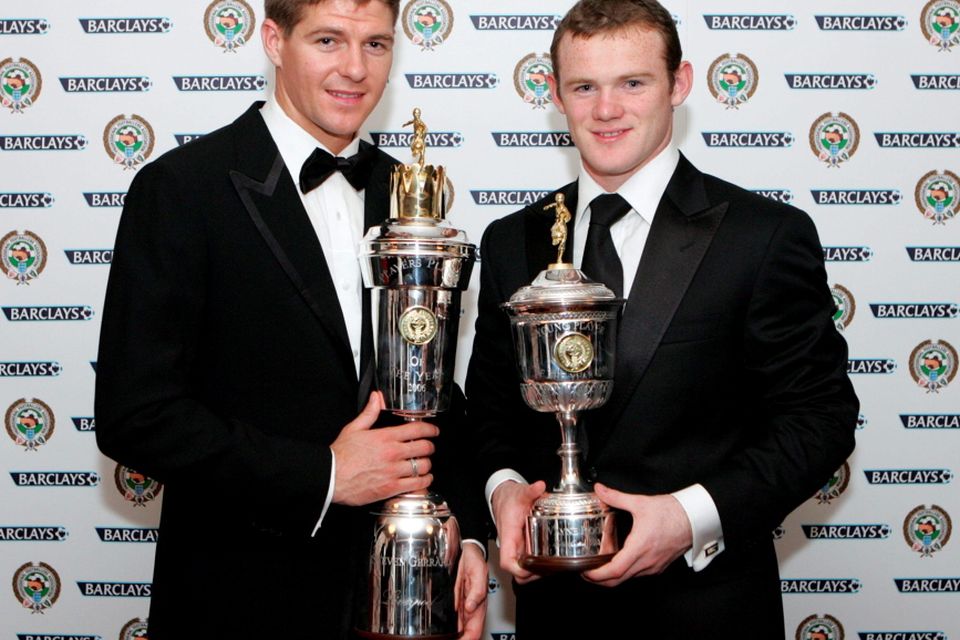 File photo dated 23-04-2006 of Liverpool's Steven Gerrard (left) and Manchester United's Wayne Rooney with their PFA awards at the Grosvenor House Hotel, London. 
Mark Lees/PA Wire.