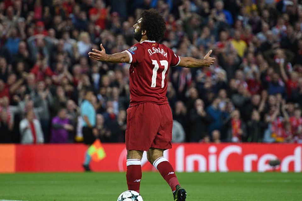 Liverpool's Egyptian midfielder Mohamed Salah celebrates scoring his team's second goal during the Champions League qualifier, second leg match between Liverpool and Hoffenheim at Anfield stadium in Liverpool on August 23, 2017. / AFP PHOTO / Oli SCARFF
