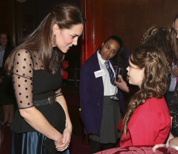 Catherine, Duchess of Cambridge meets a finalist in the child champion award, Georgia Alvey, from Cotsford Junior school in County Durham at the Place2be Wellbeing in Schools Awards Reception at Kensington Palace