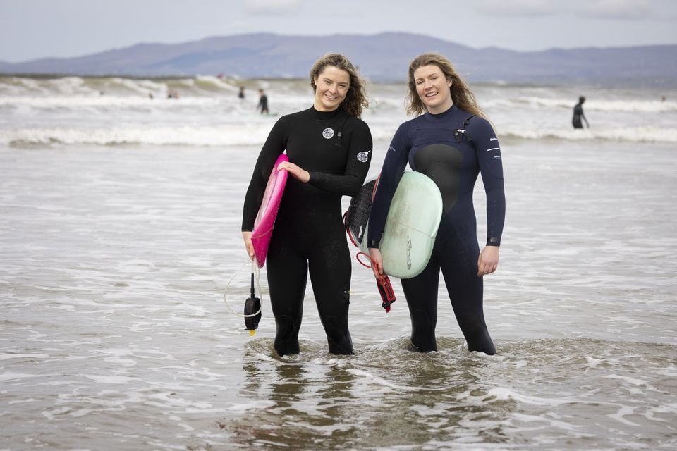 Surfers Maia Monaghan (L) and Una Britton on Rossnowlagh beach in Co. Donegal. Photo by Joe Dunne 
