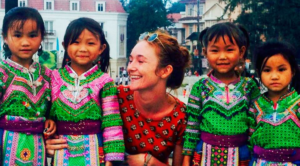 Danielle McLaughlin pictured with local children during an earlier trip to Asia, when she spent time in Thailand
