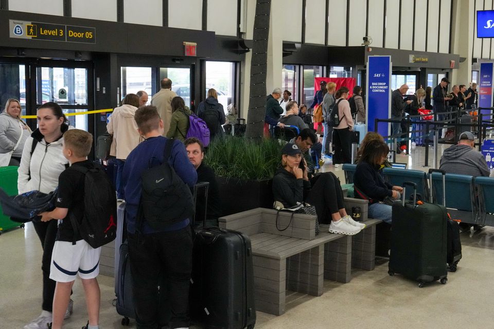 Travellers wait at a check-in terminal at Newark Liberty International Airport in Newark, New Jersey yesterday. Photo: David 'Dee' Delgado/Reuters