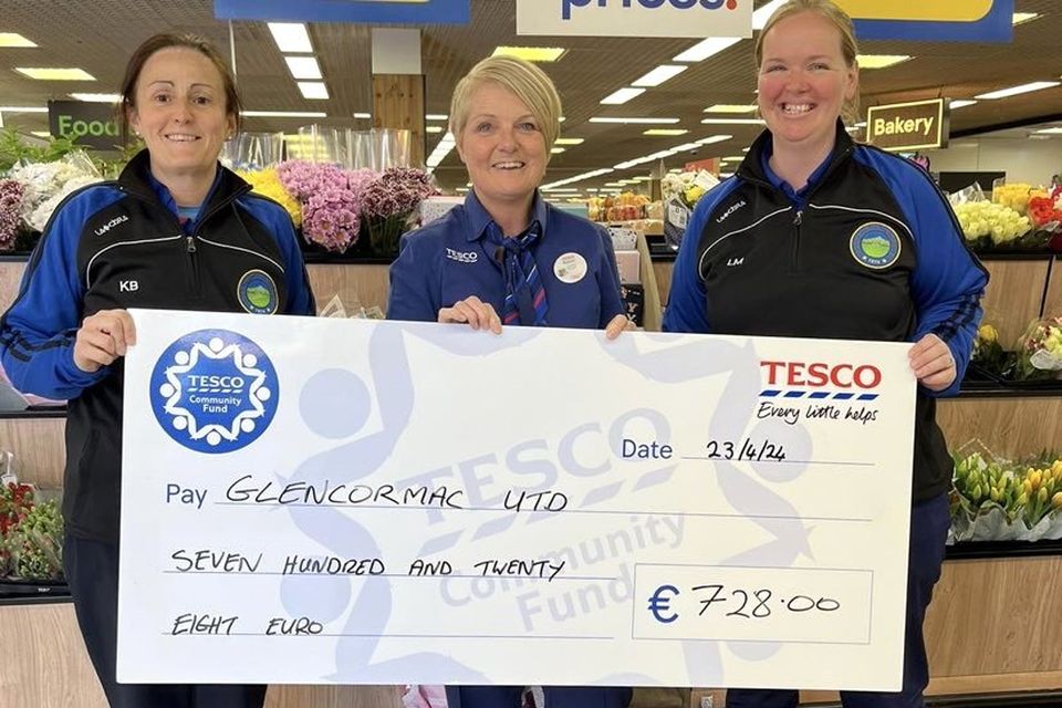 Glencormac United Ladies players and Tesco Bray employees Kathie Browne and Lindsay Martin receiving a cheque from Tesco Vevay Road Store Manager Audrey Sutton.
