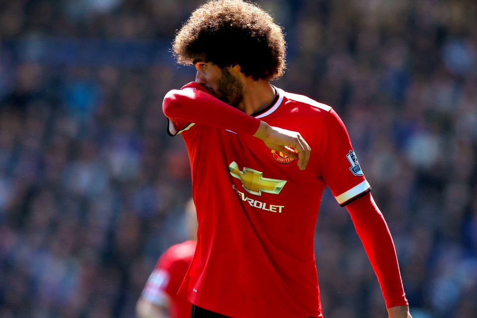 Manchester United's Marouane Fellaini looks dejected during the Barclays Premier League match at Goodison Park, Liverpool. PRESS ASSOCIATION Photo. Picture date: Sunday April 26, 2015. See PA story SOCCER Everton. Photo credit should read: Peter Byrne/PA Wire. RESTRICTIONS: Editorial use only. Maximum 45 images during a match. No video emulation or promotion as 'live'. No use in games, competitions, merchandise, betting or single club/player services. No use with unofficial audio, video, data, fixtures or club/league logos.