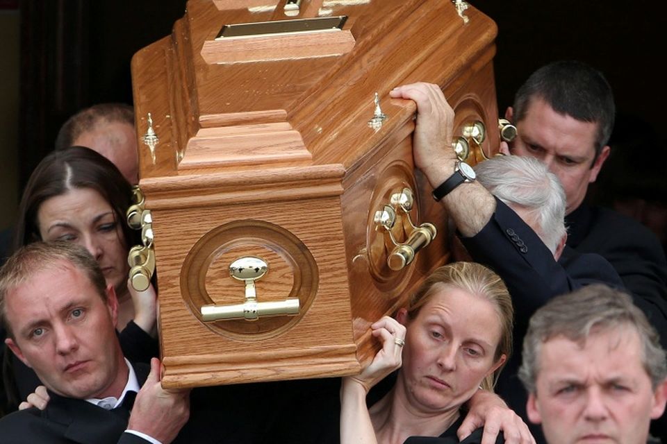 The remains are carried from church by Angela Kelly's twin sister, Amanda (front right) and other family members at the funeral of Angela Kelly who was one of three people killed in a car crash last Sunday at Middlemount on the R433 Rathdowney to Abbeyleix Road