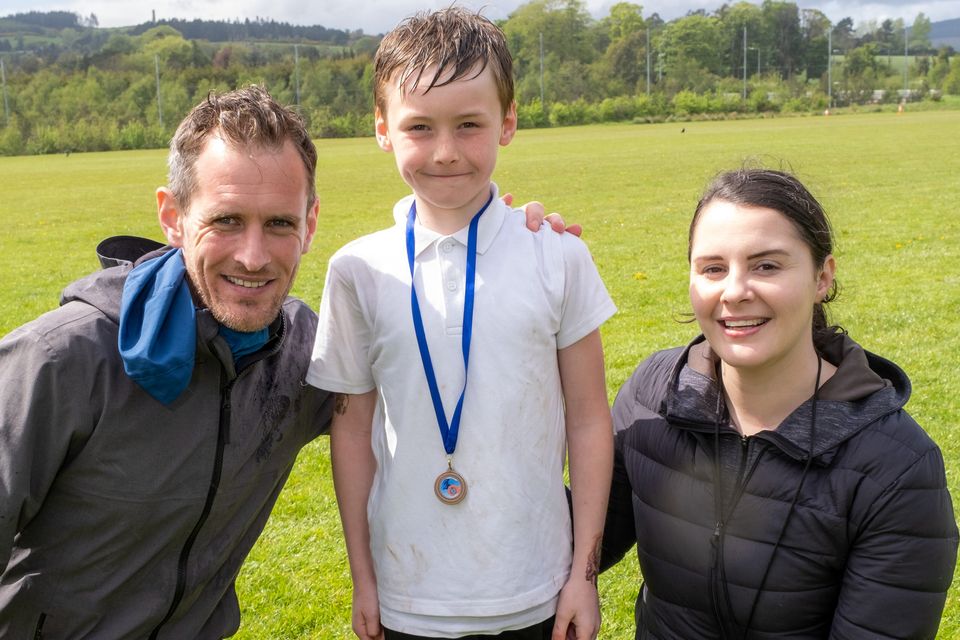 Pictured at the Scoil Mhuire Shankill Cross Country Invitational were school Principal and organiser of the event Brian Coleman with Brody Salmon, who was joint 3rd in the 4th class boys race, and his teacer Ellie MacNamara.
