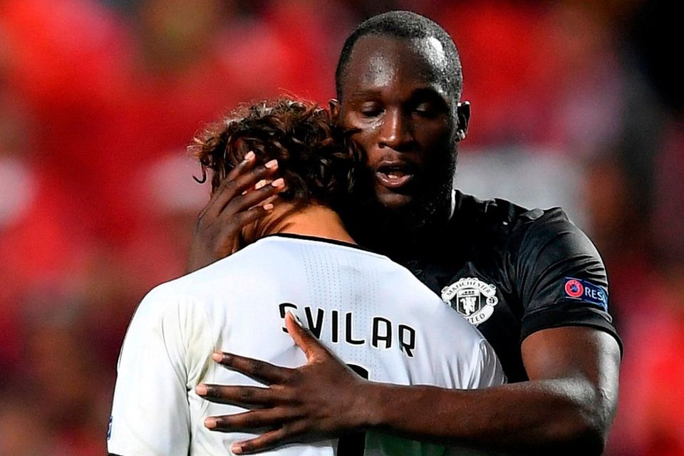 Romelu Lukaku and Mile Svilar  embrace after the UEFA Champions League group A match between SL Benfica and Manchester United at Estadio da Luz