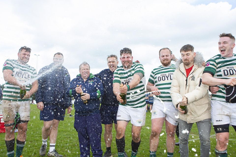 Celebration time! The Greystones players and backroom staff celebrate after they defeated Galway Corinthians.