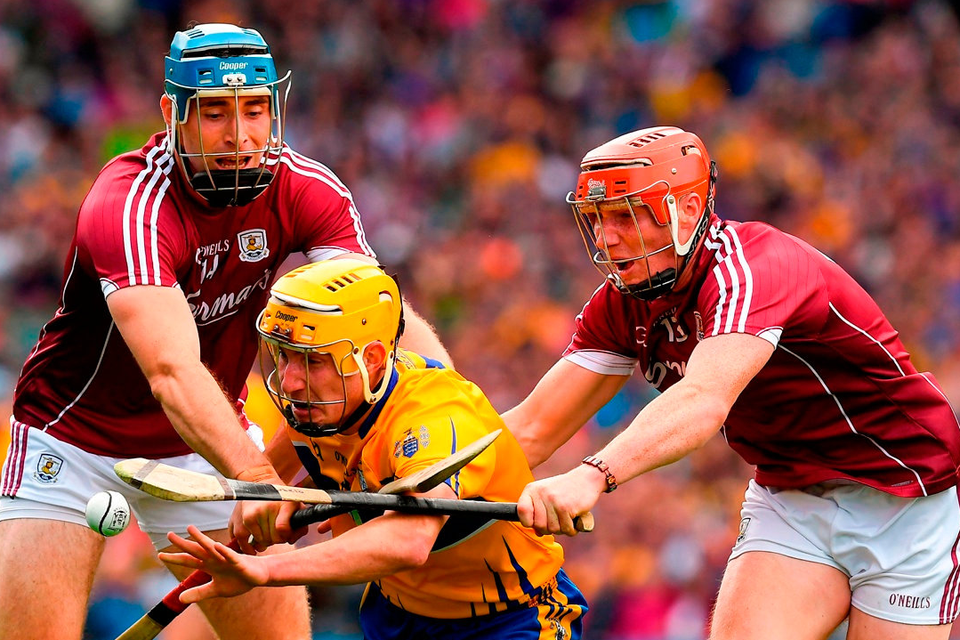 Clare sweeper Colm Galvin in action against Conor Whelan, right, and Conor Cooney of Galway at Croke Park on Saturday. Photo: Ray McManus/Sportsfile