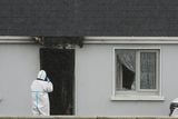 thumbnail: Scorch marks from a fire are seen at the house where John Brogan (83) was found dead on Sunday. Photo: Padraig O'Reilly