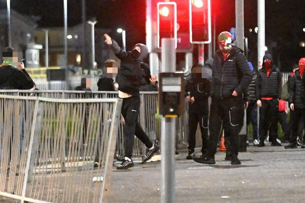 Nine PSNI officers injured, teen arrested and child struck by bottle as rioting mars Irish Cup clash