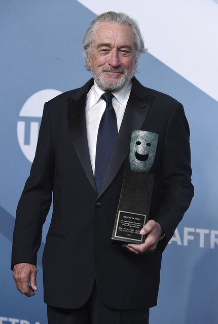 Robert De Niro poses with his lifetime achievement award (Jordan Strauss/Invision/AP)