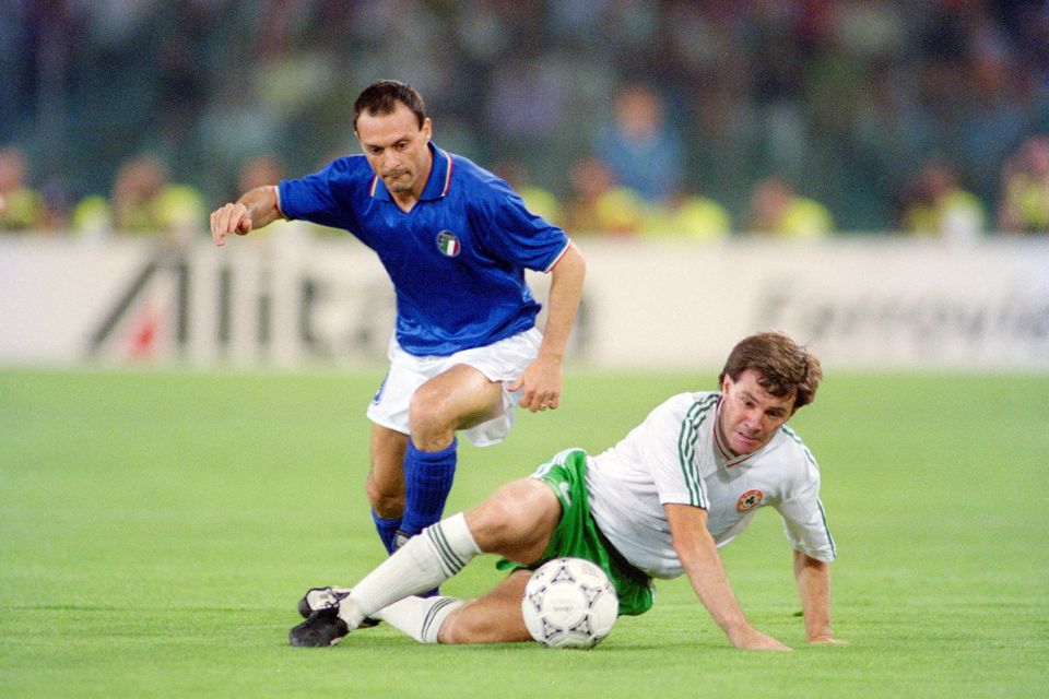 Republic of Ireland player Ray Houghton is challenged by Salvatore Schillaci during the 1990 FIFA World Cup quarter-final at the Olympic Stadium, Rome in June 1990. Photo: Allsport/Getty Images