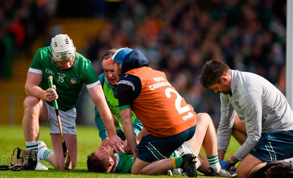 Limerick's Peter Casey is treated to on the pitch after his horror injury. Photo: Sportsfile
