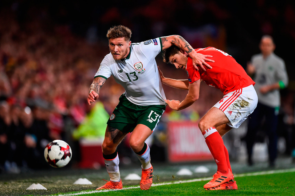 Jeff Hendrick skips by Wales’ Ben Davies during last night’s World Cup qualifier at Cardiff City Stadium. Photo: Sportsfile