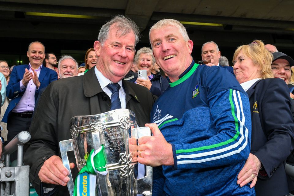 Limerick manager John Kiely celebrates with businessman JP McManus and the Liam MacCarthy Cup after the county's victory in the All-Ireland SHC final last July. Photo by Ray McManus/Sportsfile