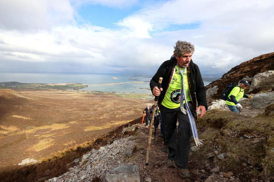 Charlie Bird makes his way to the top of Croagh Patrick. Picture by Gerry Mooney.