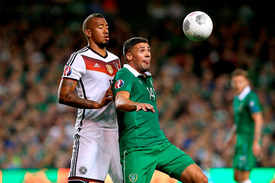 Germany's Jerome Boateng and Republic of Ireland's Jonathan Walters (right) battle for the ball during the UEFA European Championship Qualifying match at the Aviva Stadium, Dublin. PRESS ASSOCIATION Photo. Picture date: Thursday October 8, 2015. See PA story SOCCER Republic. Photo credit should read: Brian Lawless/PA Wire.
