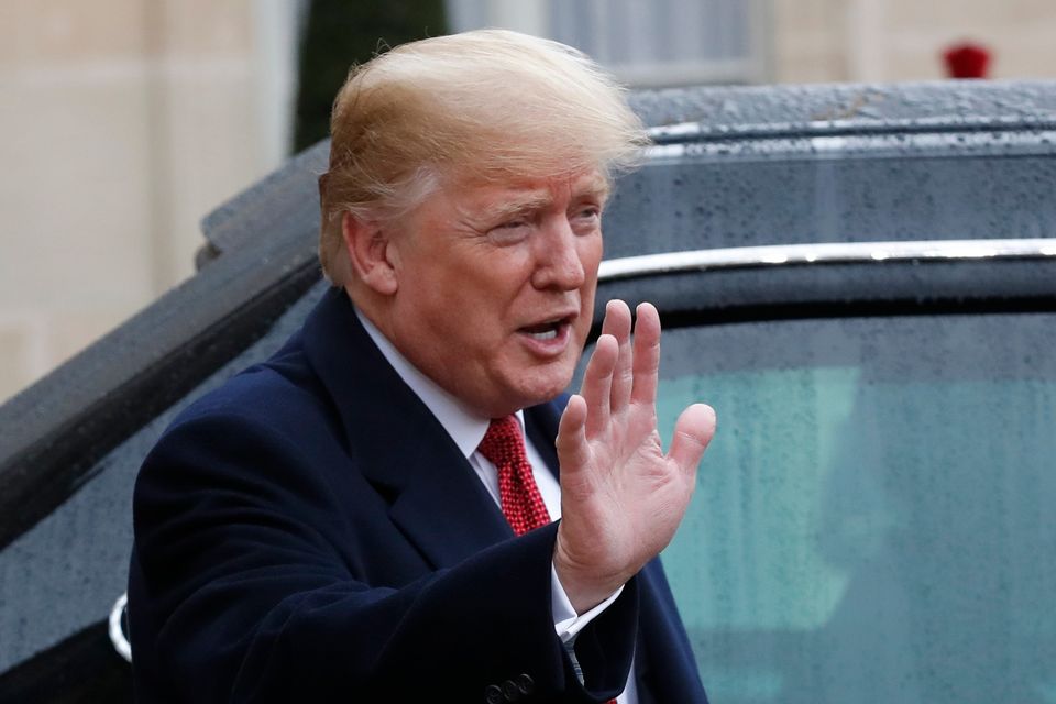 US President Donald Trump has been criticised for failing to go to the cemetery (Thibault Camus/AP)