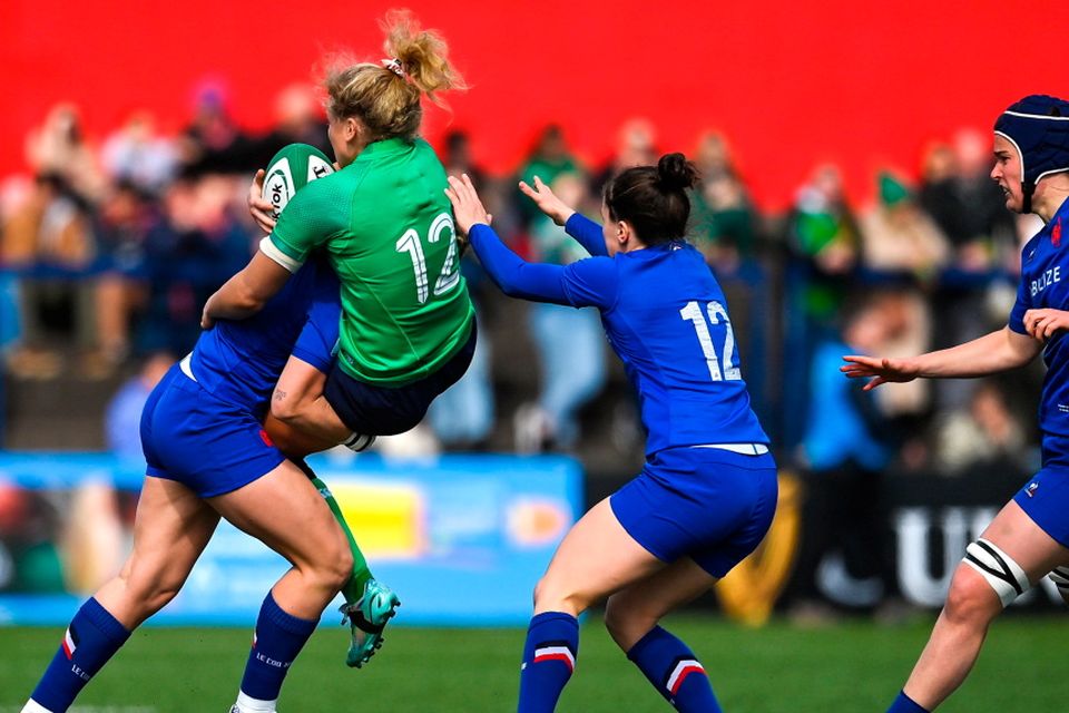 Vicky Irwin of Ireland is tackled by Marine Menager of France