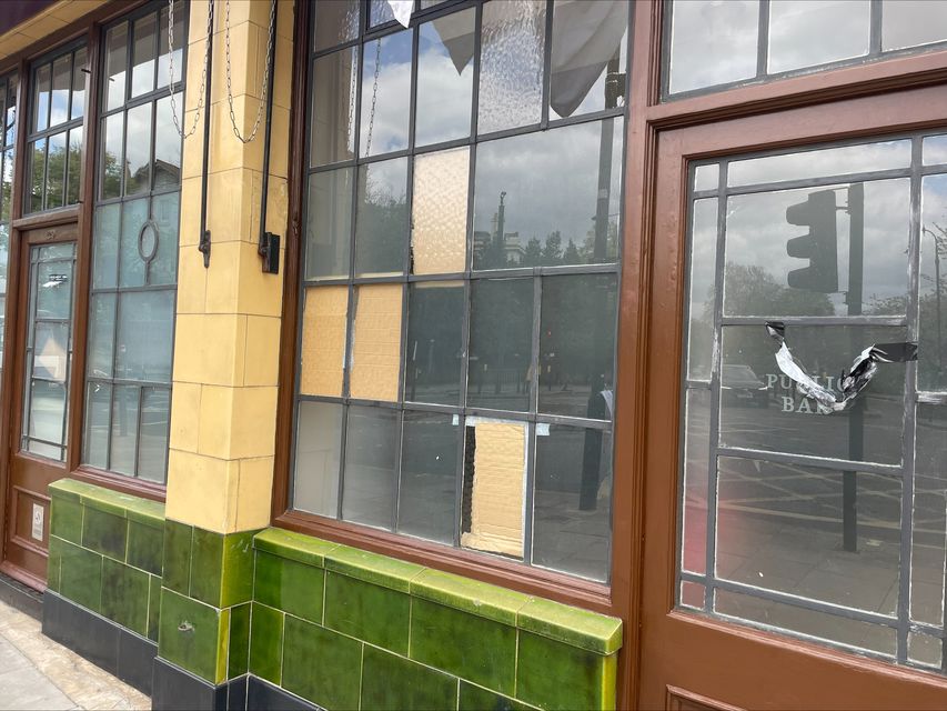 Boarded up windows at the York & Albany pub (Samuel Montgomery/PA)