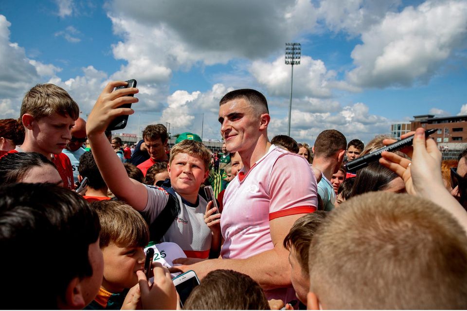 Seán O'Shea poses for pictures with supporters after the All-Ireland SFC Group 1 Round 3 game against Louth in Portaloise