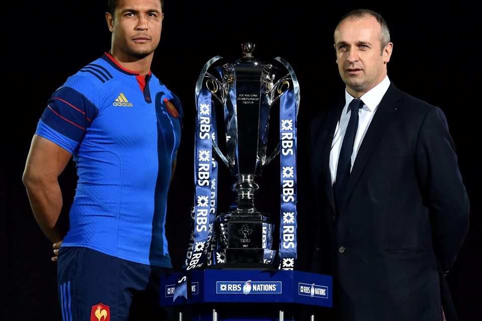 France coach Philippe Saint-Andre (right) and captain Thierry Dusautoir pose with the new Six Nations trophy at the launch of the 2015 championship. Photo: BEN STANSALL/AFP/Getty Images