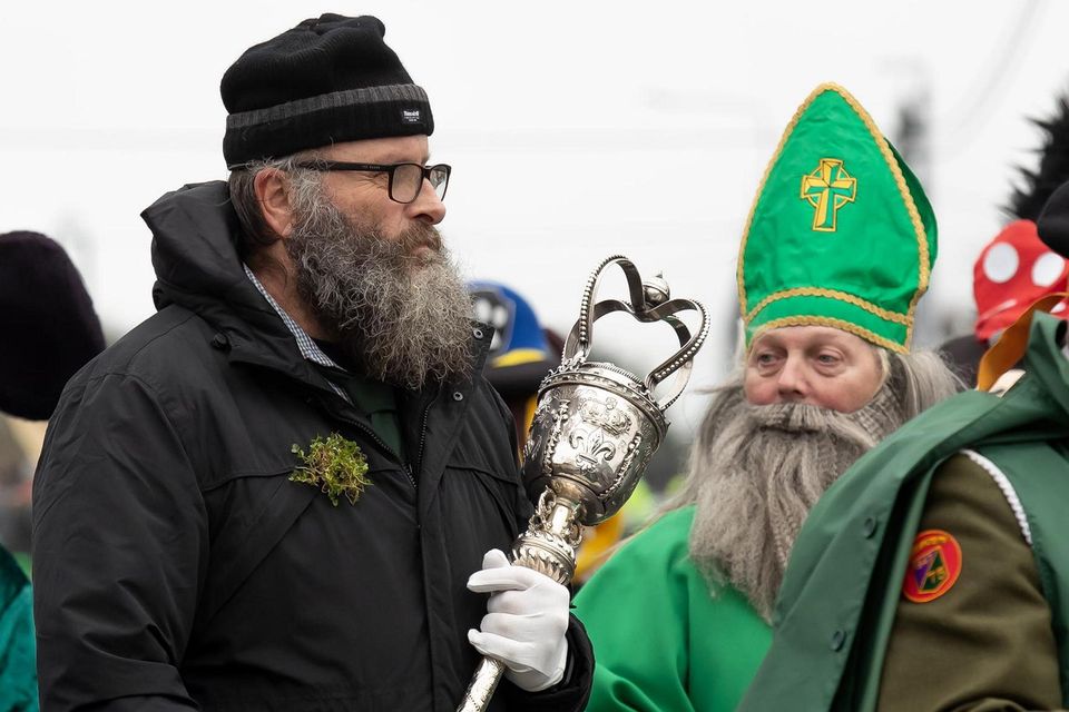 Niall O’Neill carrying the Town Mace beside St Patrick. Photo: Mary Browne