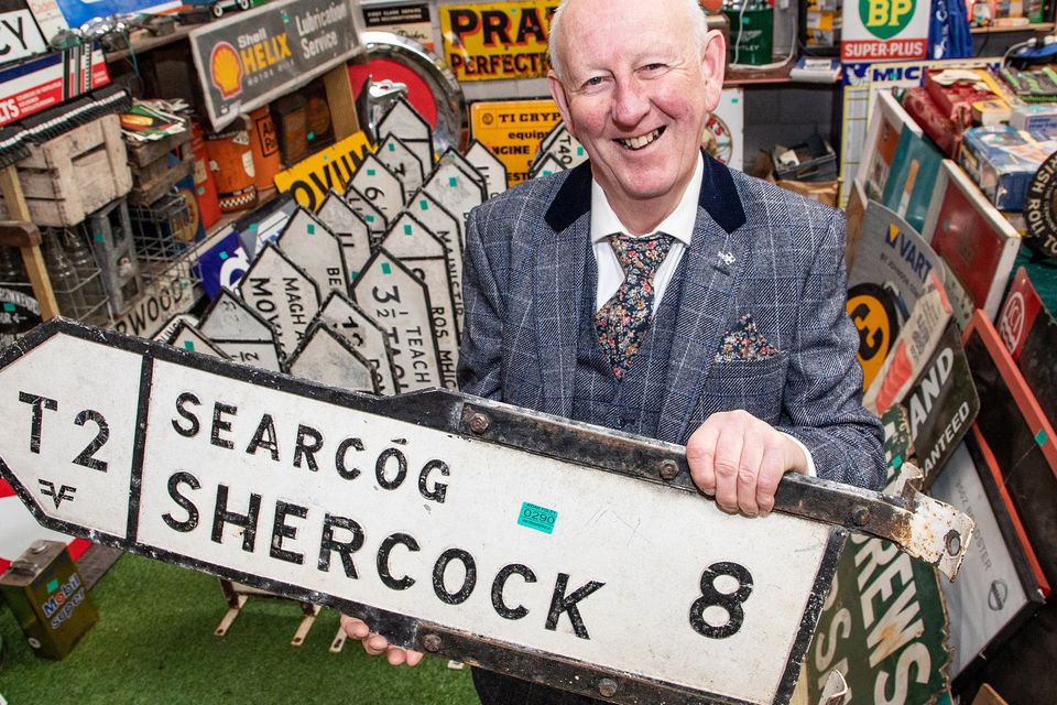 Hugh Nolan, 65, with one of his 200 vintage Irish street signs (Michael Donnelly/MediaConsult/PA)