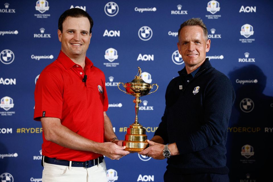 USA captain Zach Johnson, left, and Europe captain Luke Donald with the Ryder Cup during a 2023 Ryder Cup press conference in Rome. Photo: Guglielmo Mangiapane/Reuters