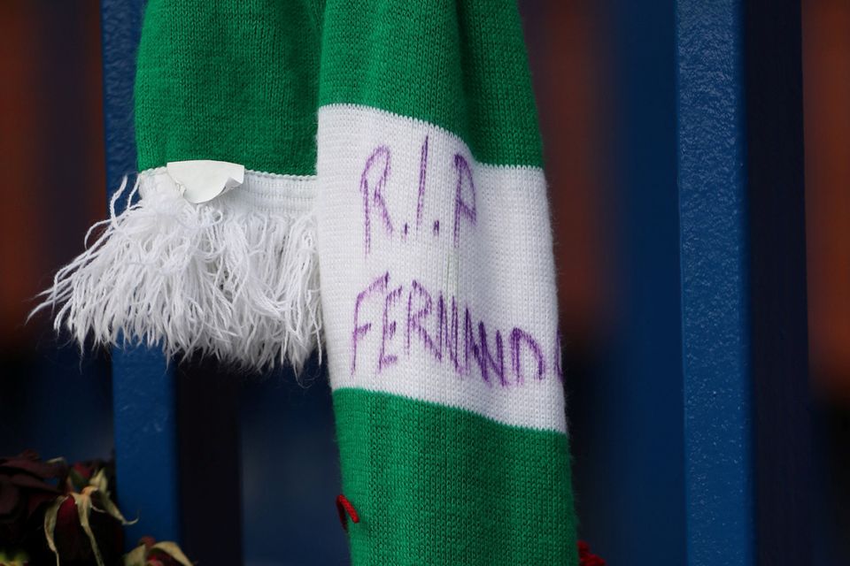 A Celtic scarf and tribute to former Rangers player Fernando Ricksen