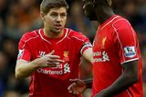 thumbnail: Liverpool captain Steven Gerrard (L) speaks with teammate Mario Balotelli during their English Premier League soccer match against Hull City at Anfield in Liverpool, northern England October 25, 2014.