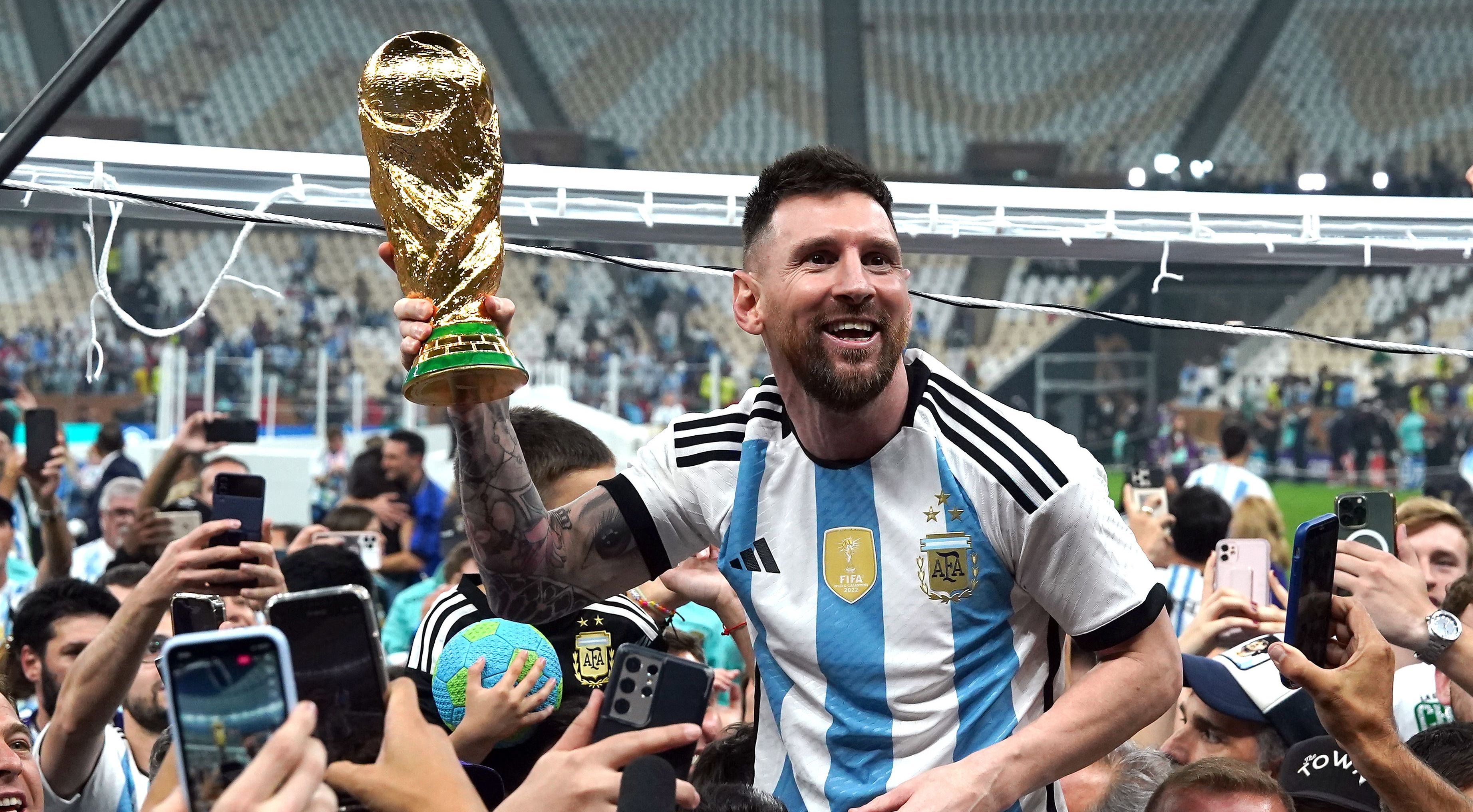 What was Lionel Messi wearing during World Cup trophy lift? - The Athletic