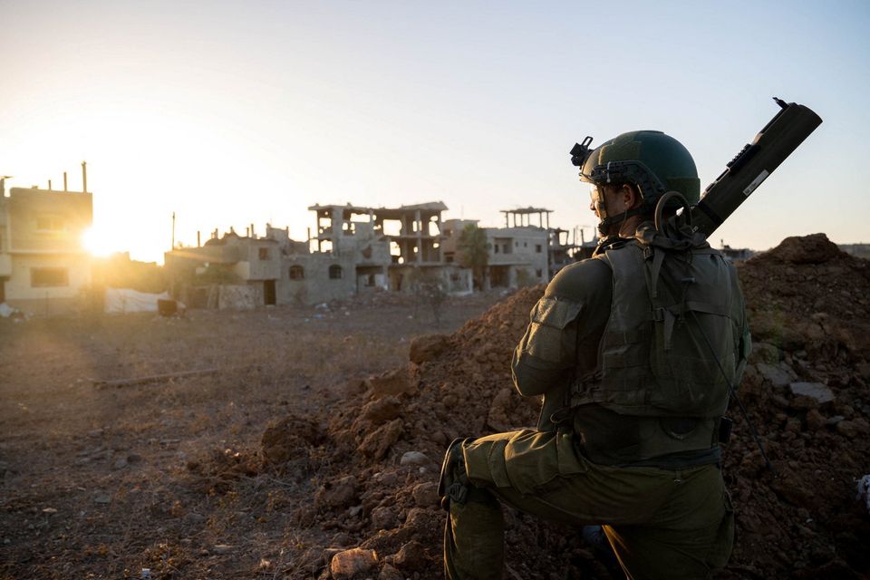 An Israeli soldier takes position during the ongoing ground operation of the Israeli army against Palestinian Islamist group Hamas, at a location given as Gaza, in this picture released on November 17, 2023. Israeli Defence Forces/Handout via REUTERS THIS IMAGE HAS BEEN SUPPLIED BY A THIRD PARTY