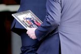 thumbnail: A Bruton family picture is brought to the church. Photo: Gerry Mooney