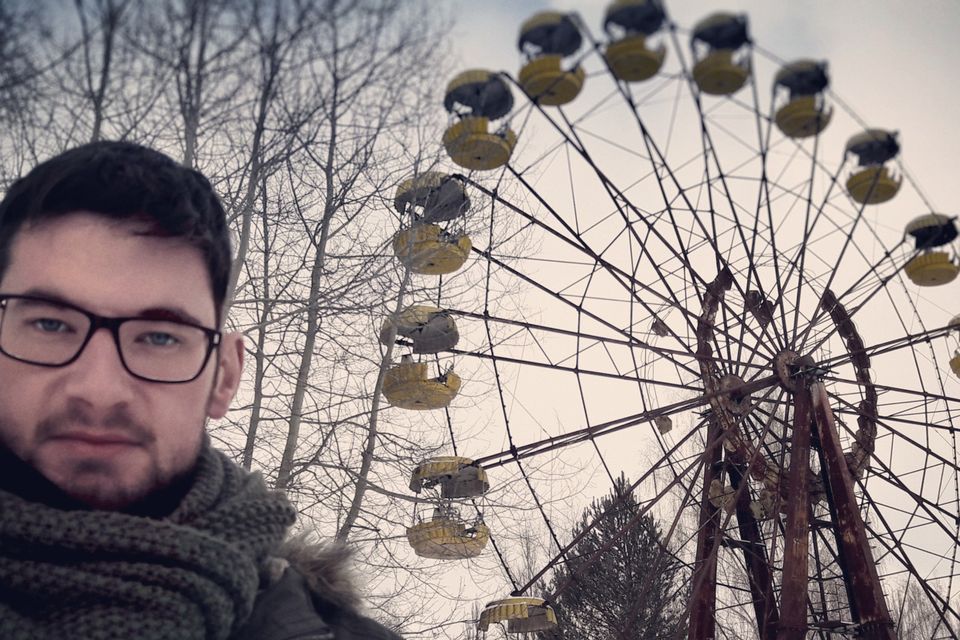 Wayne in front of the iconic ferris wheel in the abandoned city of Pripyat