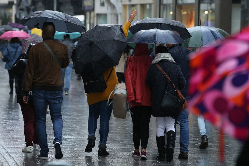 Shoppers on Grafton Street brave some recent heavy rain
